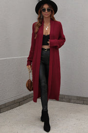 Textured knit maxi cardigan in wine with open front and long sleeves.