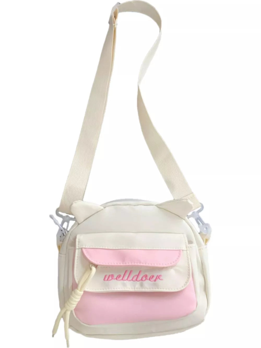 White and pink crossbody bag with cat ears and adjustable strap.