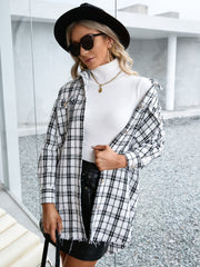 Textured plaid shacket with raw hem in black and white, open front with button detail.