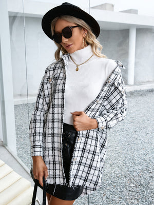Textured plaid shacket with raw hem in black and white, open front with button detail.