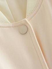 Cream utility pocket bomber jacket with button detail and ribbed collar.