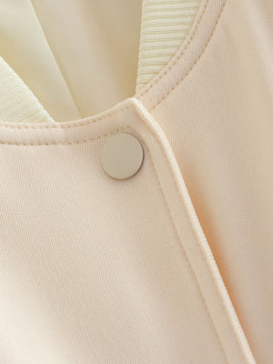 Cream utility pocket bomber jacket with button detail and ribbed collar.