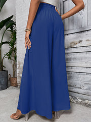 Royal blue ruffled waistline palazzo trousers with wide legs.