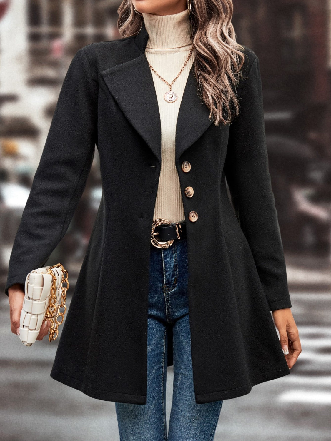 Black wool blend coat with buttoned front and flared hem