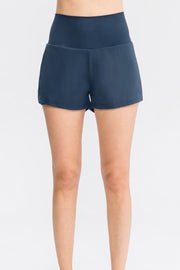 Sculpted high-waist active shorts in dark blue with a flattering fit.