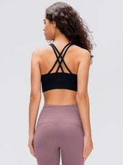Black sports bra with crisscross back straps and wide band