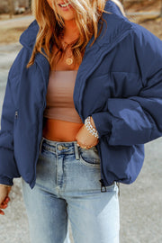 Cobalt blue padded crop jacket with stand collar and zipper detail