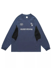 Relaxed fit royal blue long-sleeve tee with black paneling and graphic print.