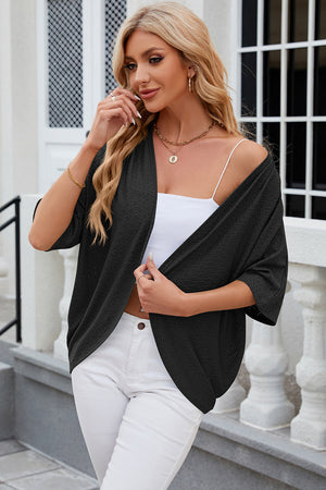 Black open-front crochet kimono sleeve top with a textured pattern.