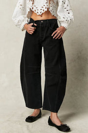 Black denim barrel leg jeans with button fly and paneled knees
