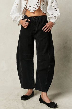 Black denim barrel leg jeans with button fly and paneled knees