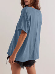 Dusty blue cotton oversized tee with seam detail and raw hem sleeves.