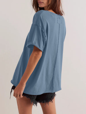 Dusty blue cotton oversized tee with seam detail and raw hem sleeves.