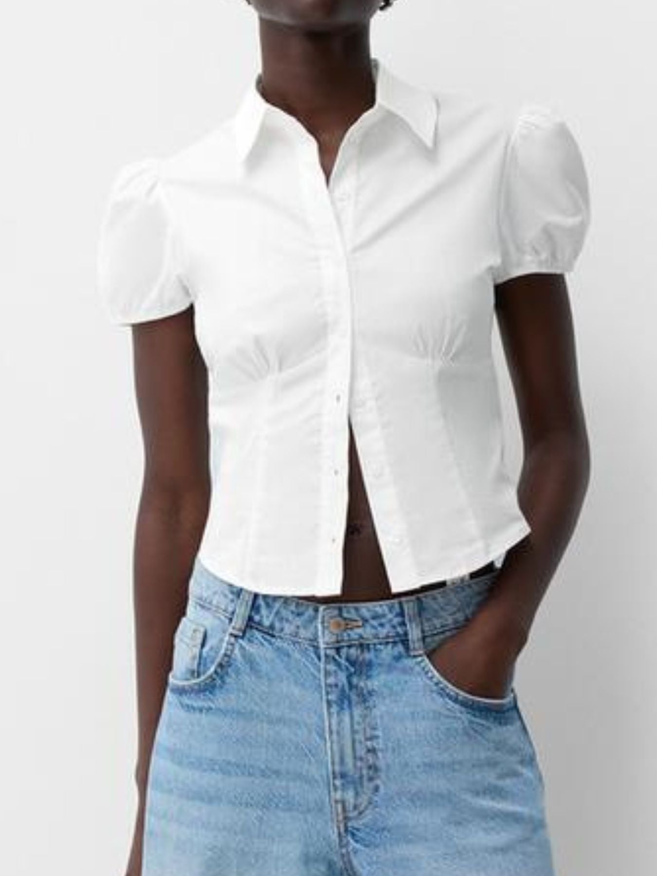 White puff sleeve fitted button-up shirt with a collared neckline.