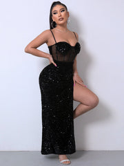Black sequin corset maxi dress with sheer bodice and high slit.