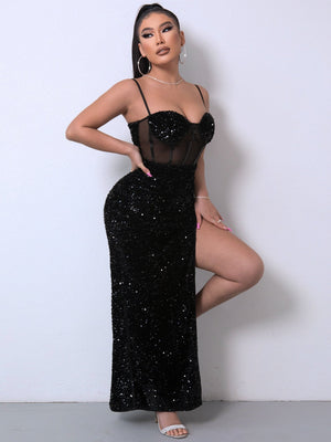 Black sequin corset maxi dress with sheer bodice and high slit.