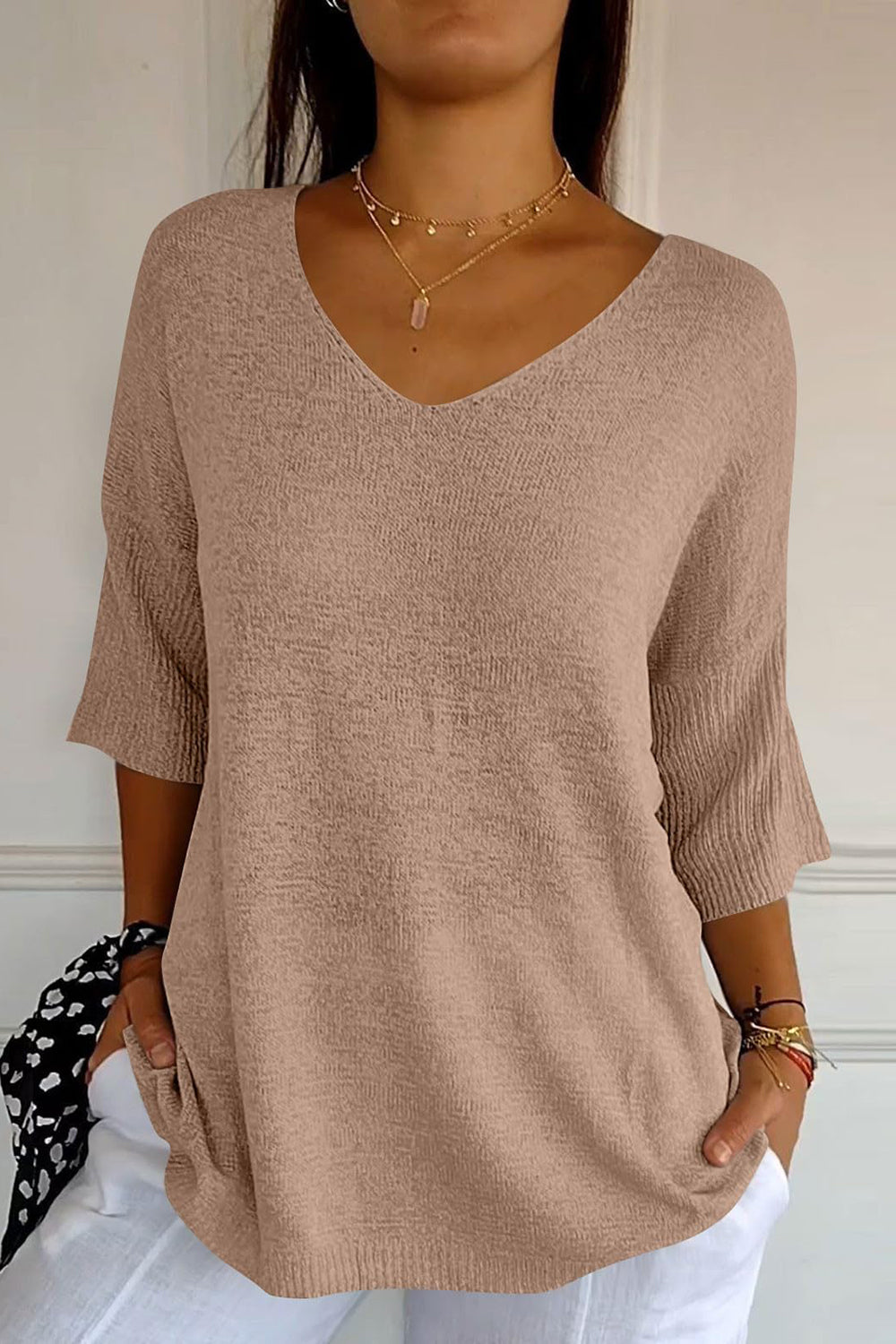 Tan knit sweater with V-neck and flared sleeves, casual everyday top