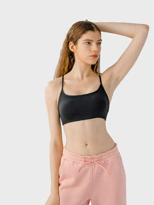 Black active crop top with thin straps and a scoop neckline.