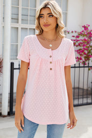 Blush pink eyelet yoke gathered henley shirt with short sleeves and button detail.