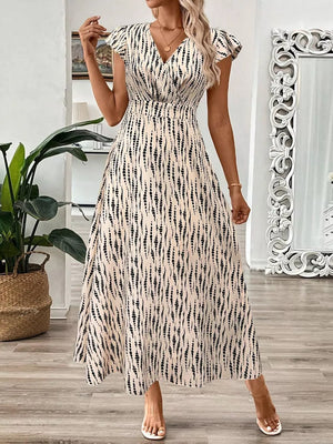Apricot floral print midi dress with cap sleeves and a V-neckline.