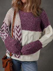 Patchwork cable-knit sweater in mauve and cream with chevron sleeves.
