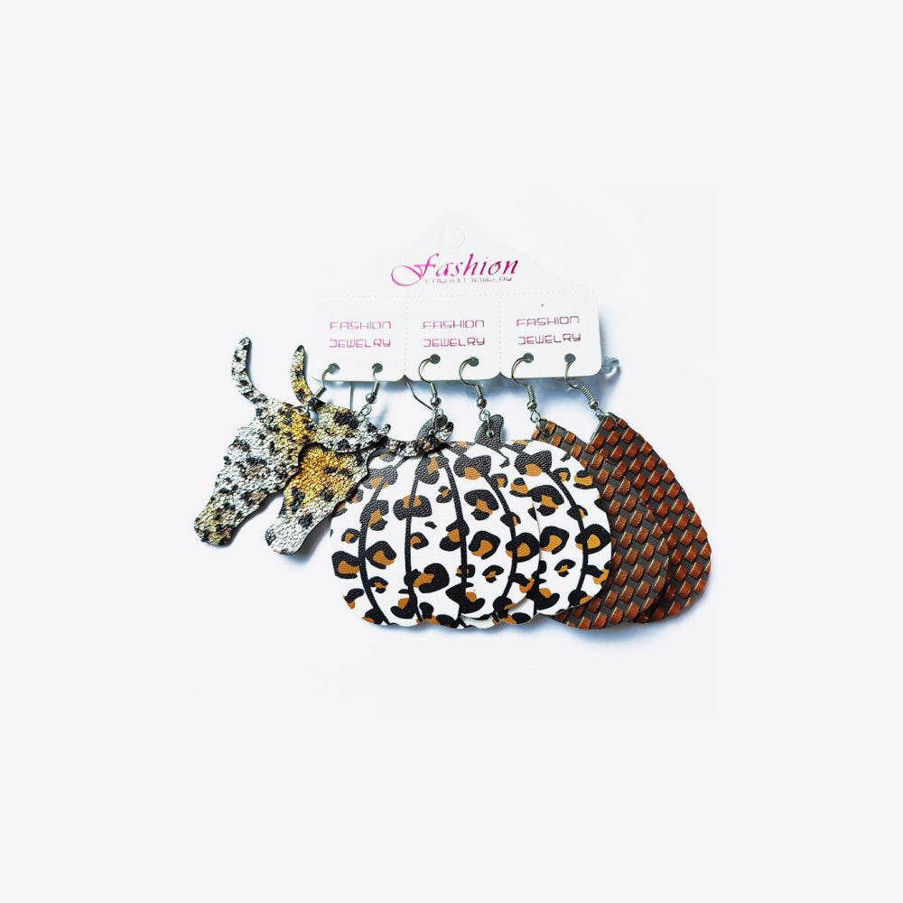 Leopard print and glitter earrings trio with pumpkin and woven designs.