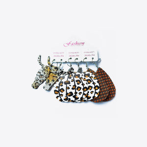 Leopard print and glitter earrings trio with pumpkin and woven designs.