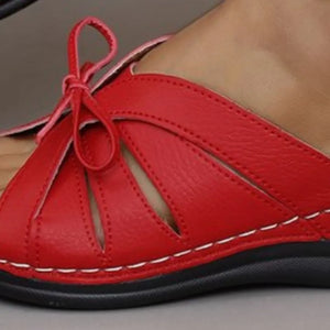 Deep Red leather lace-up cutout slides with white stitching detail.