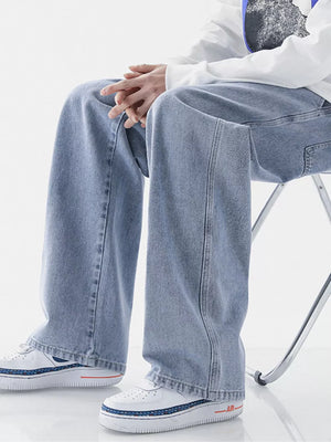 Light blue relaxed wide-leg jeans with drawstring waist and visible stitching detail.