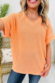 Sherbet waffle knit v-neck t-shirt with cuffed short sleeves.