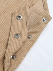 Tan corduroy overall dress detail showing snap closures