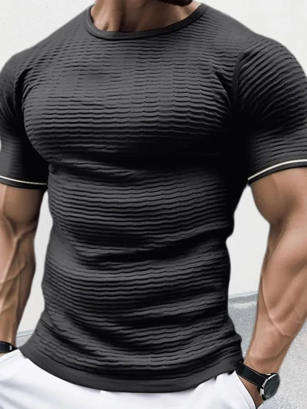 Black textured knit sculpted fit t-shirt with crew neck and short sleeves.