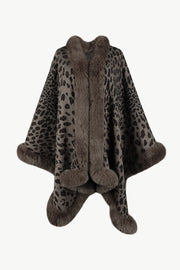 Leopard print cape with faux fur trim and cuffs in beige acrylic.