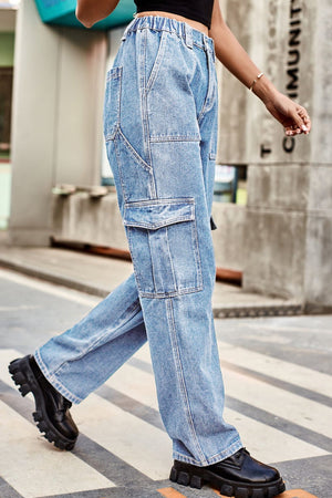 Light wash denim cargo pants with relaxed fit and multiple pockets.
