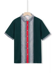 Dark green men's short sleeve shirt with bold geometric print and red button placket.