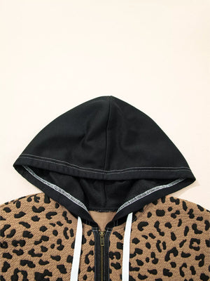 Zip front hoodie with leopard print and black hood, featuring white drawstrings.