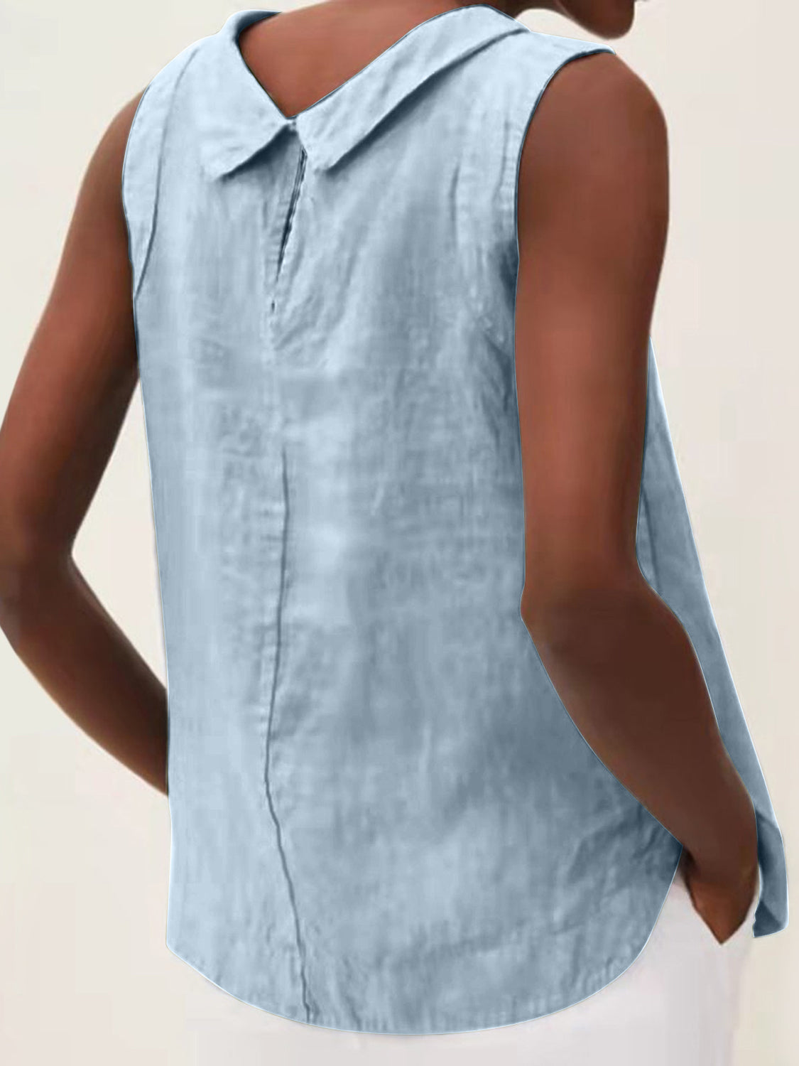 Light blue sleeveless Peter Pan collar blouse with back seam detail