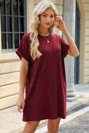 Burgundy cuffed sleeve casual dress with crew neck and relaxed fit.