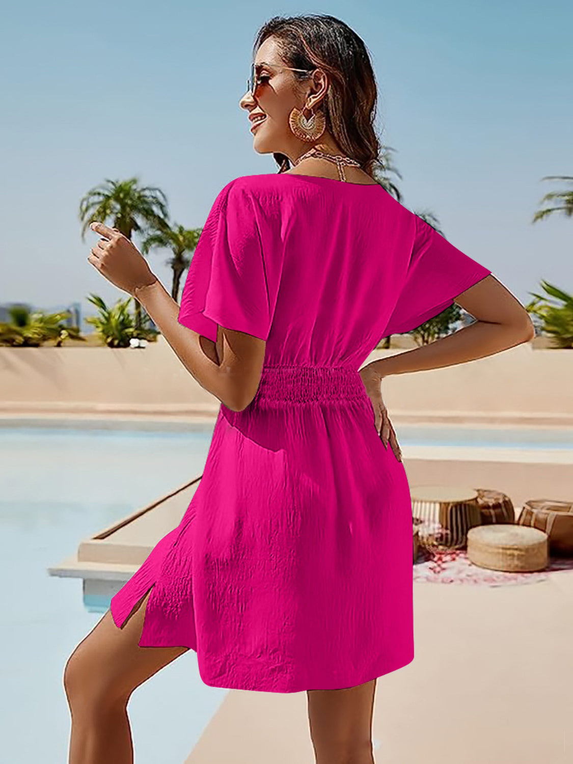 Hot Pink shirred waistline flutter sleeve mini dress with side slits.