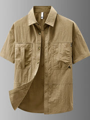 Khaki lightweight casual short-sleeve button-up shirt with dual chest pockets.