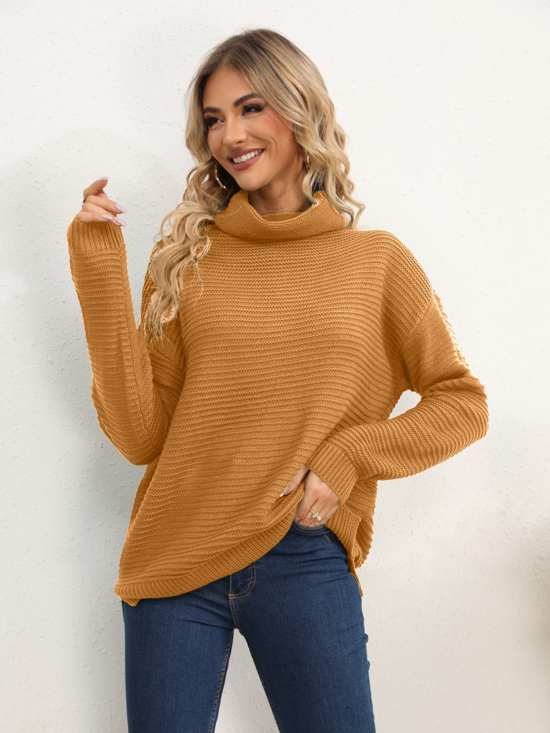 Textured knit oversized turtleneck pullover in mustard acrylic with a relaxed fit.