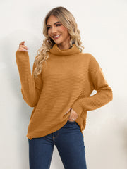Textured knit oversized turtleneck pullover in mustard acrylic with a relaxed fit.