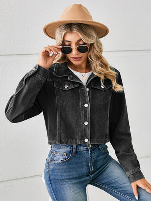 Black cropped denim trucker jacket with button front and chest pockets.