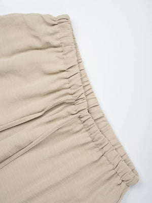 Tan maternity pants with drawstring waist and wide legs