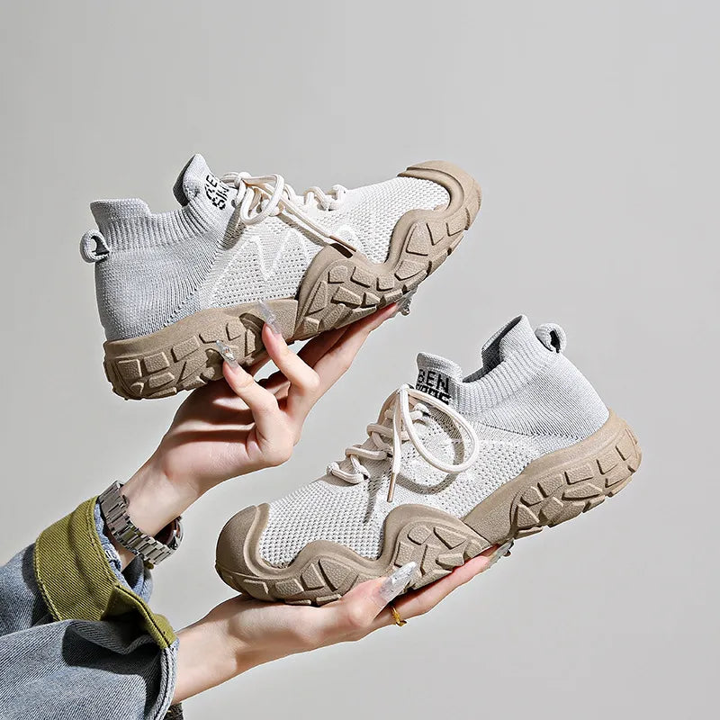 Sculpted knit athleisure sneakers in light beige with chunky tan soles and white laces.