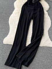 Black strapless wide-leg jumpsuit with a belted waist and feather trim detail.