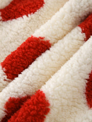 Heart print sherpa hoodie in cream with red hearts, showing fuzzy texture.