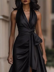 Black satin maxi dress with halter neckline, cinched waist, and ruffled high-low hem.