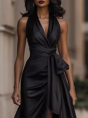 Black satin maxi dress with halter neckline, cinched waist, and ruffled high-low hem.