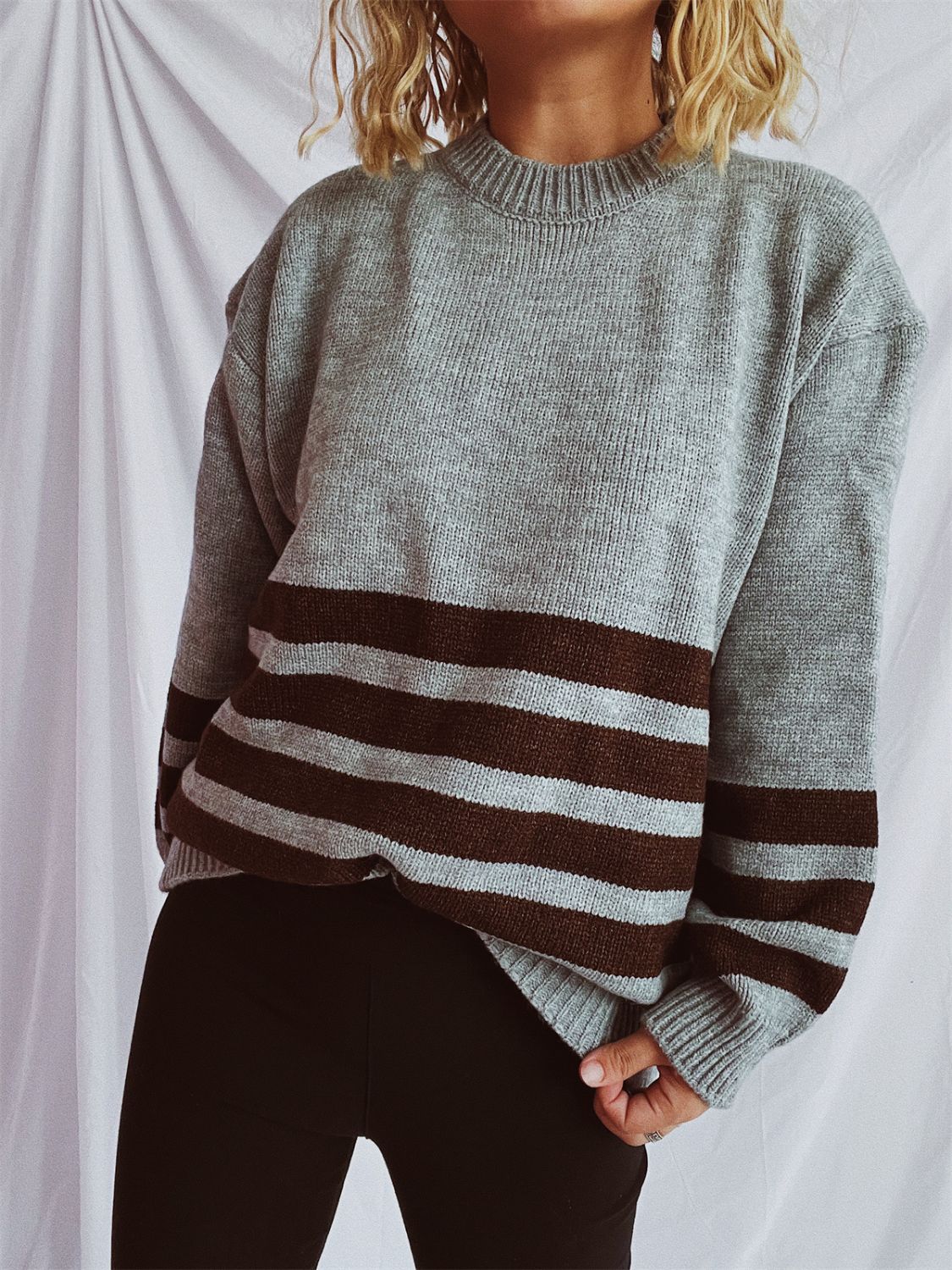 Horizontal stripe ribbed knit sweater in mocha, dark gray, or tan acrylic.
